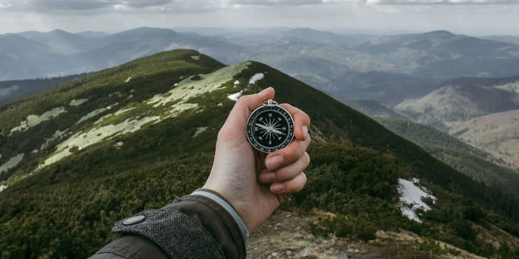 Person holding compass
